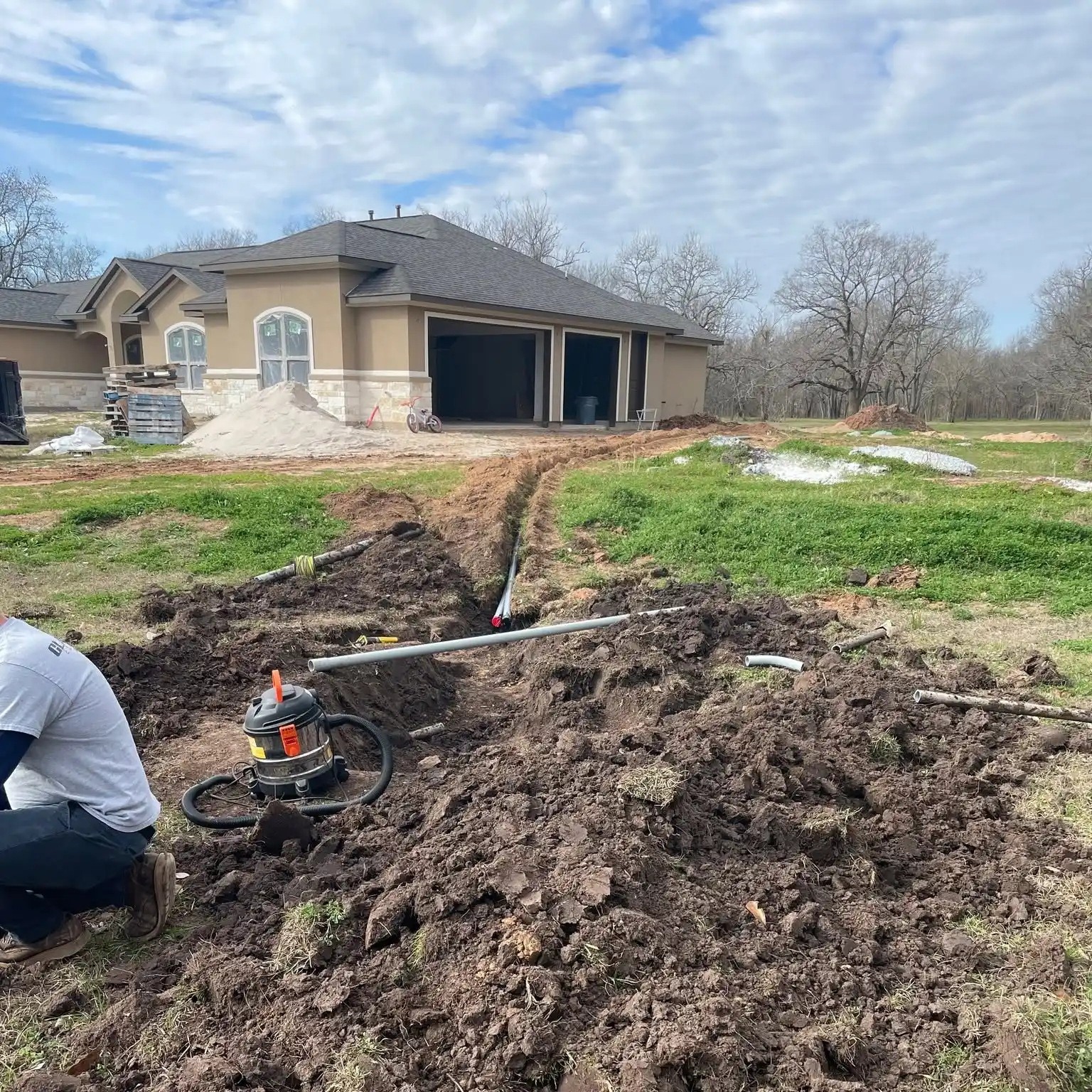 Gladiator Electric crew trenching underground conduit for high-voltage power service in Richmond TX